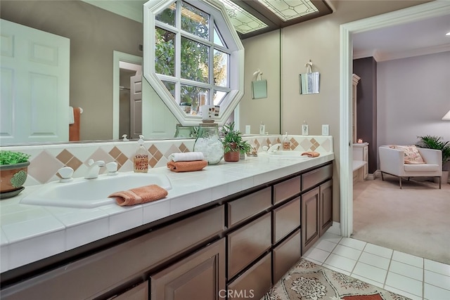 bathroom with ornamental molding, tile patterned flooring, and vanity