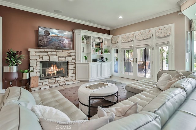 living room with a fireplace and crown molding