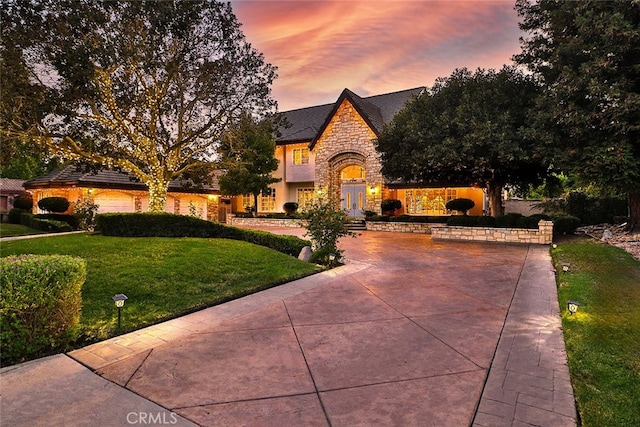 view of front of property with a yard