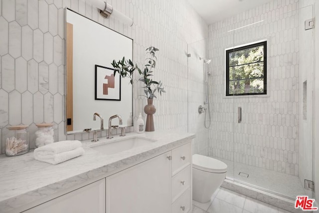 bathroom with vanity, toilet, and walk in shower