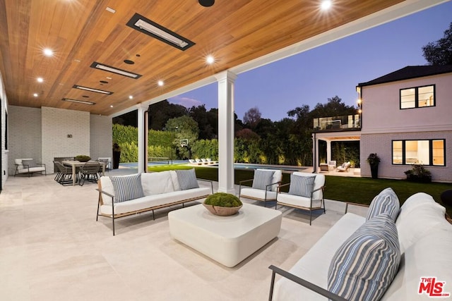 patio terrace at dusk with an outdoor hangout area