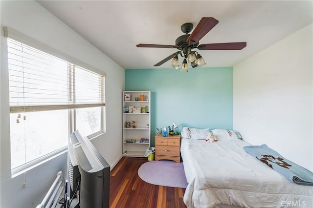 bedroom featuring dark hardwood / wood-style floors and ceiling fan