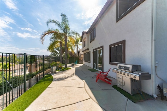 view of patio with a grill