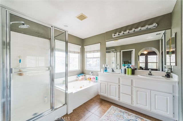 bathroom with shower with separate bathtub, tile patterned floors, and vanity