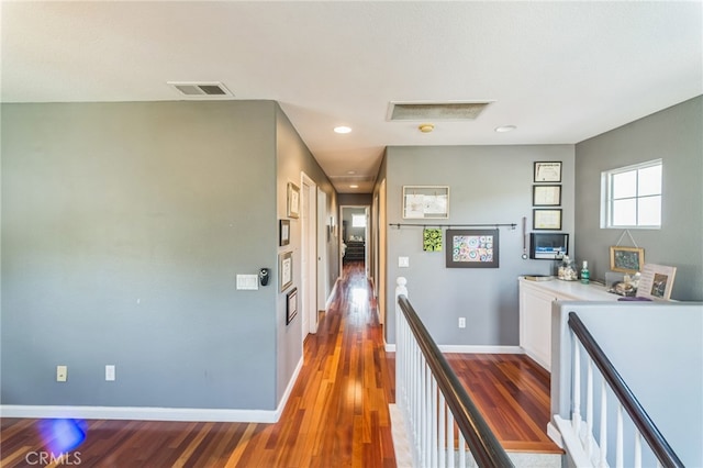 hall with hardwood / wood-style flooring