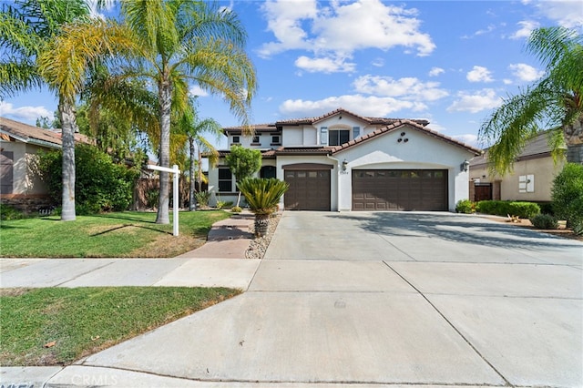 mediterranean / spanish-style house with a front lawn