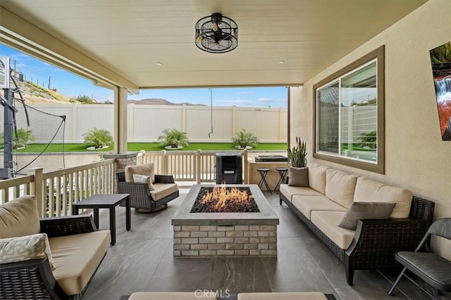 sunroom / solarium featuring a healthy amount of sunlight and wooden ceiling