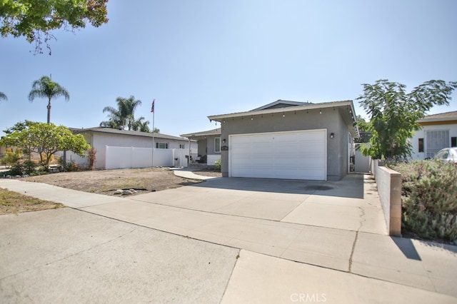 ranch-style house featuring a garage