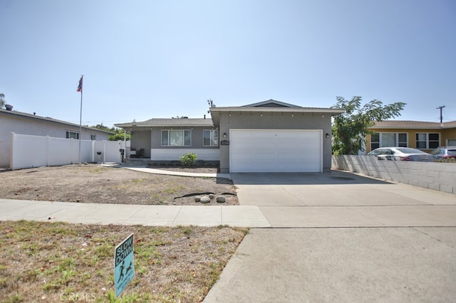 ranch-style house featuring a garage