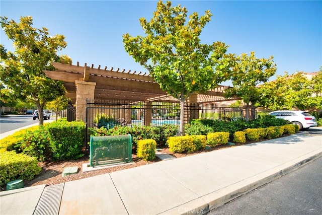 view of home's community featuring a pergola