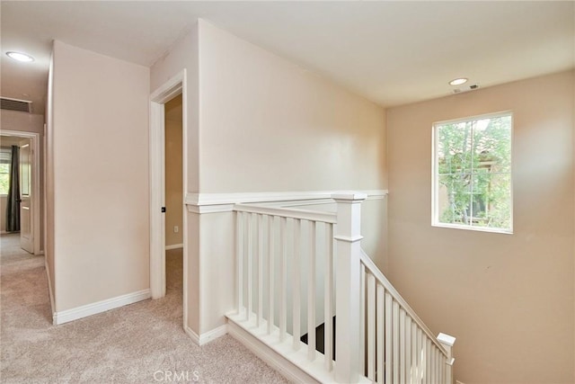 hallway with light carpet