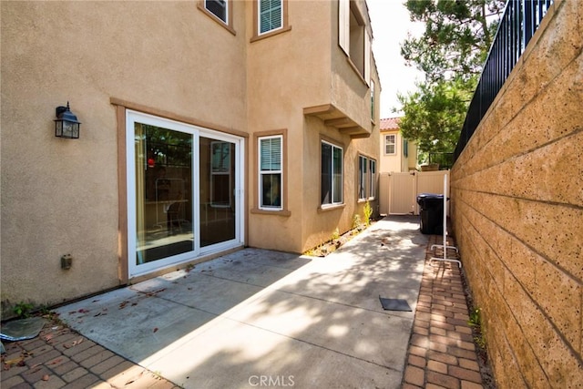 view of side of home featuring a patio area