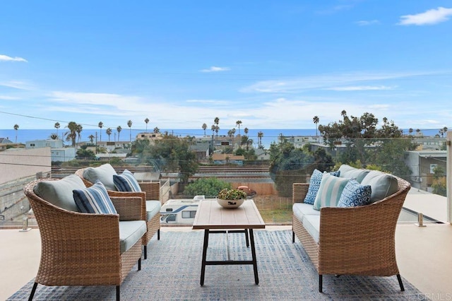 balcony with outdoor lounge area and a water view