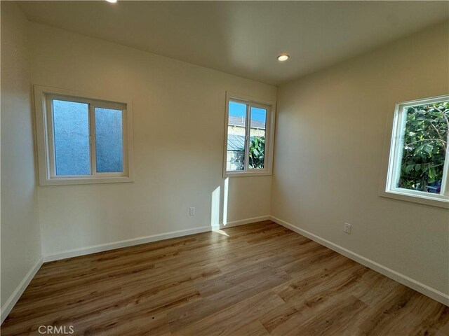 unfurnished room featuring light hardwood / wood-style flooring