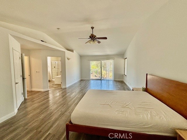 bedroom featuring lofted ceiling, ceiling fan, ensuite bathroom, and dark wood-type flooring