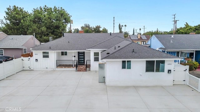 back of property featuring a patio