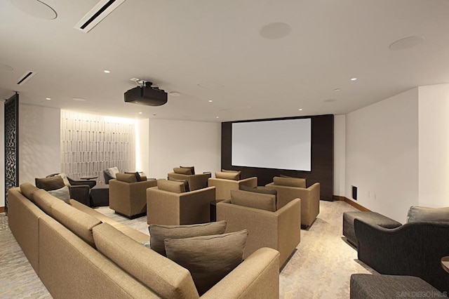 cinema room featuring light colored carpet