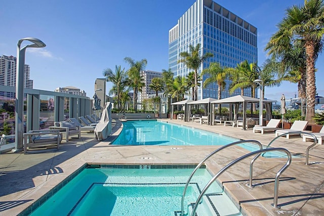 view of swimming pool featuring a gazebo, a patio area, and a hot tub