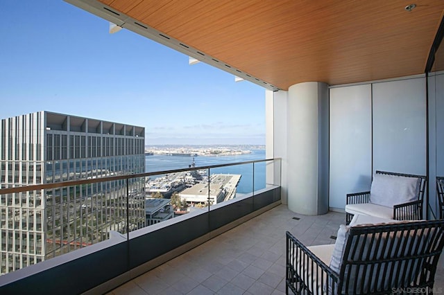 balcony featuring a water view