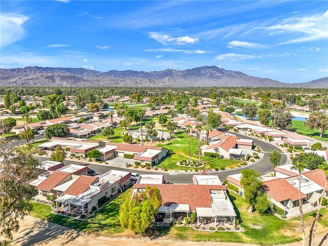 birds eye view of property with a mountain view