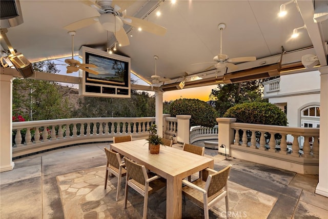 view of patio terrace at dusk