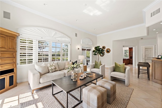 living room featuring light tile patterned floors and ornamental molding