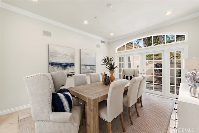 tiled dining space with french doors and crown molding