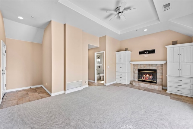 unfurnished living room with ceiling fan and light colored carpet