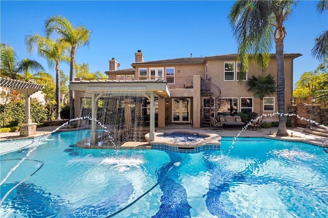 view of swimming pool featuring an in ground hot tub, french doors, and a patio