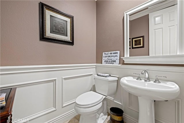 bathroom featuring sink and toilet