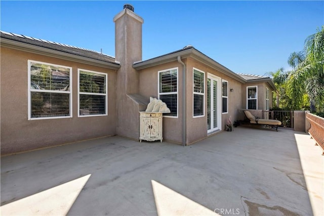 back of property with a patio area