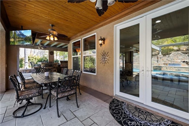 exterior space featuring ceiling fan and french doors