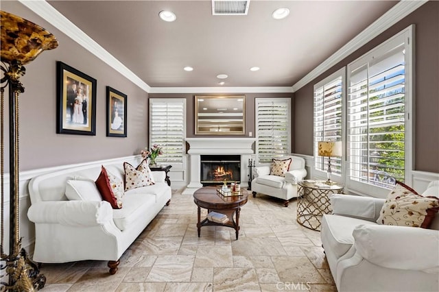 living room featuring crown molding