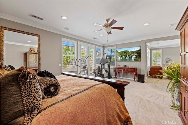 carpeted bedroom featuring multiple windows, crown molding, and ceiling fan