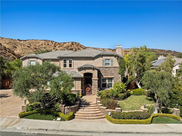 view of front of home featuring a mountain view