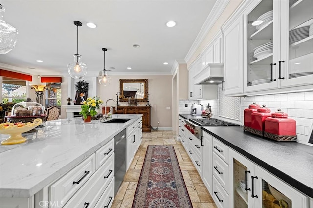 kitchen featuring white cabinets, pendant lighting, sink, and stainless steel appliances