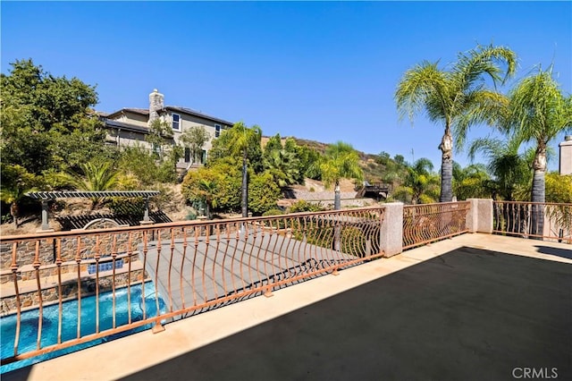 view of patio / terrace with a fenced in pool