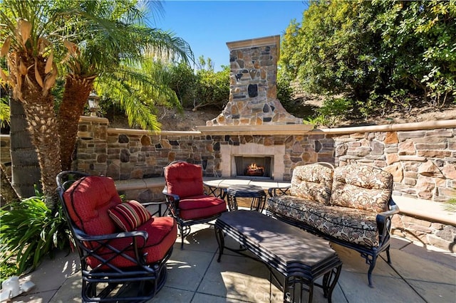 view of patio / terrace featuring an outdoor living space with a fireplace