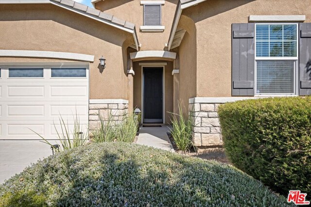 entrance to property featuring a garage