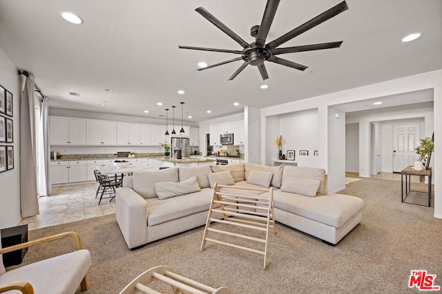 living room featuring ceiling fan