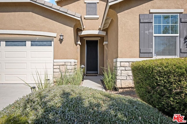 property entrance featuring a garage