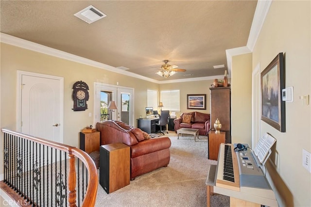 carpeted living room featuring crown molding, ceiling fan, and french doors