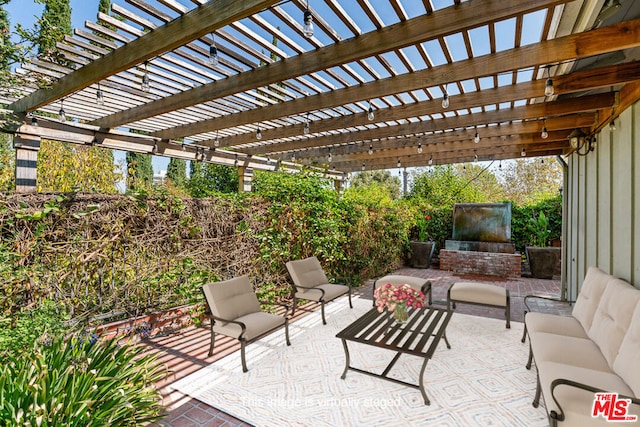 view of patio with outdoor lounge area and a pergola