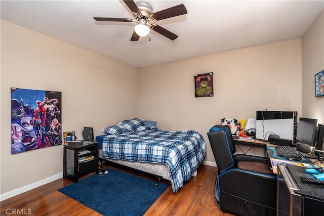 bedroom with ceiling fan and dark hardwood / wood-style floors