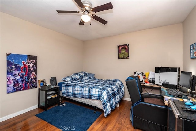 bedroom with wood finished floors, baseboards, and ceiling fan