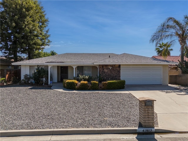 single story home with a garage