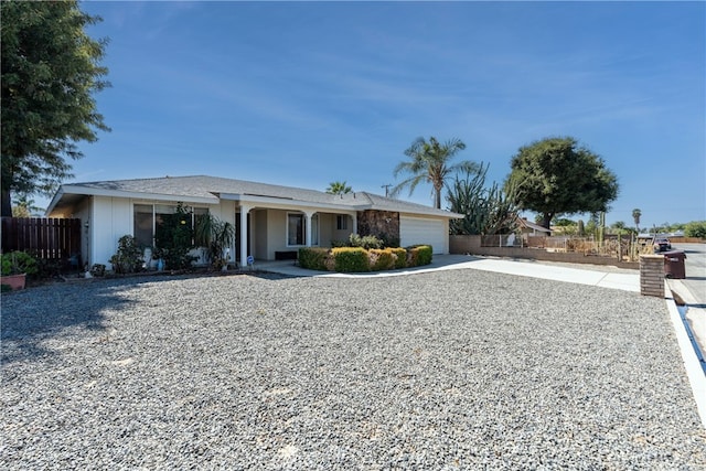 ranch-style house featuring a garage