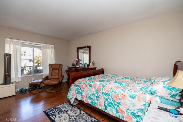 bedroom with wood-type flooring