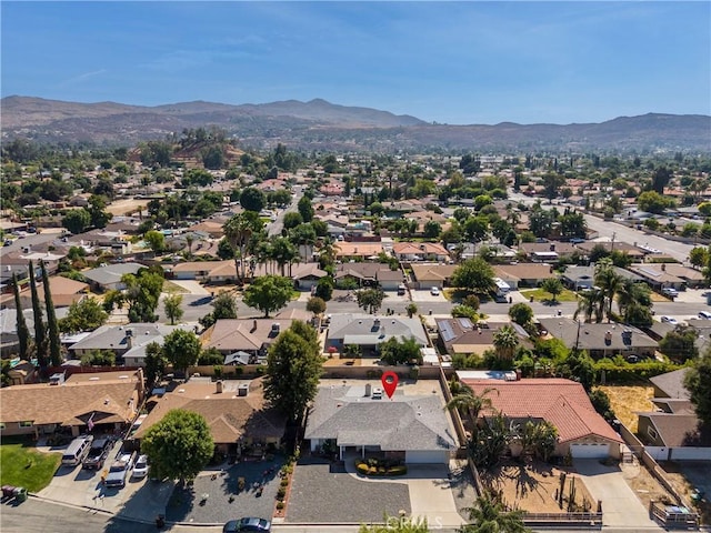 birds eye view of property with a mountain view and a residential view
