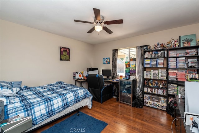 bedroom with ceiling fan and hardwood / wood-style floors